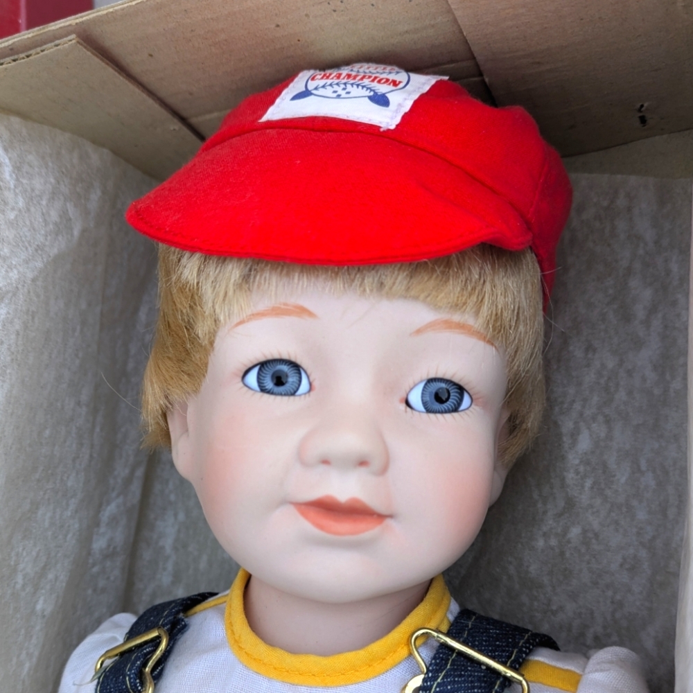Little Champion Porcelain Doll with Red Baseball Cap